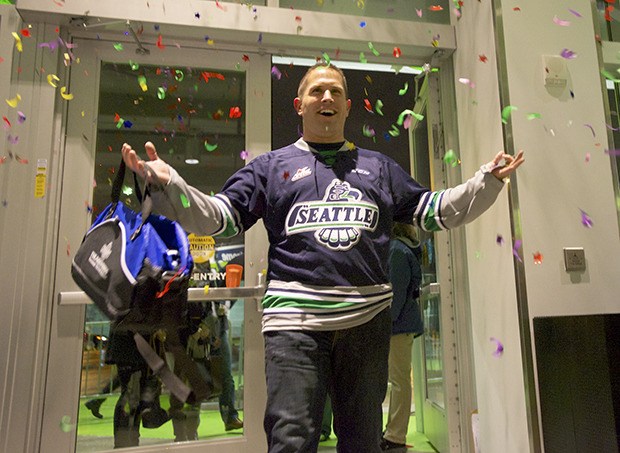 A surprised Eric Hannon enters the ShoWare Center as the venue’s two-millionth guest last Friday night.