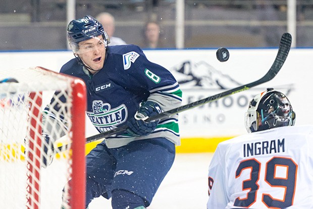 The Thunderbirds' Scott Eansor battles for the puck in front of Blazers goalie Connor Ingram during WHL play Friday night.