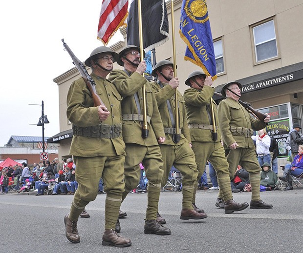 The American Legion as World War I Doughboys march in last year's Veterans Day Parade in Auburn. The parade returns Saturday.