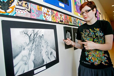 Emma Fitzpatrick displays her work during the 2011 Kent Student Art Walk. This year's event runs from March 10-21 in downtown and at Kent Station.