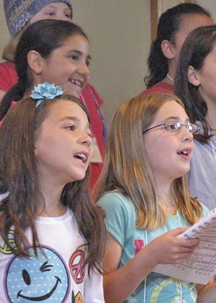 Local kids sing during the Rainier Youth Choir's Summer Choir Camp Pajama Day.