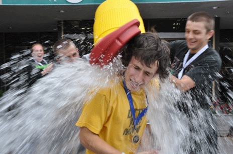 Max Manthou was doused by a friend after winning his fourth straight Class 4A state singles tennis title two weeks ago.