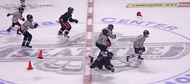 Youngsters sprint down the open ice during an agility drill at the Seattle Thunderbirds’ inaugural Stick Handling