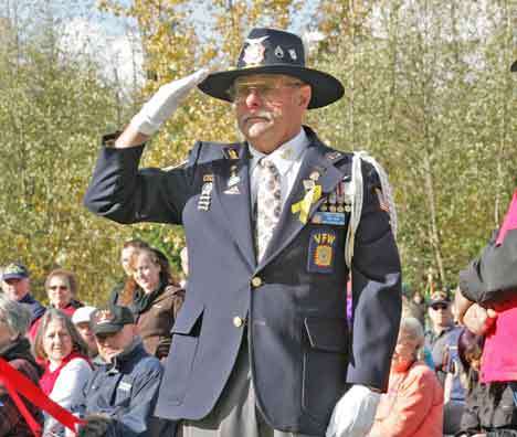 Army veteran Bill Graham salutes the Army flag during Veterans Day ceremonies Nov. 11 at the Tahoma National Cemetery in Kent.