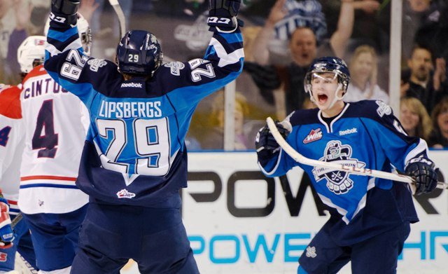 Roberts Lipsbergs and Sam McKechnie celebrate a goal in the Thunderbirds' win over the Chiefs.