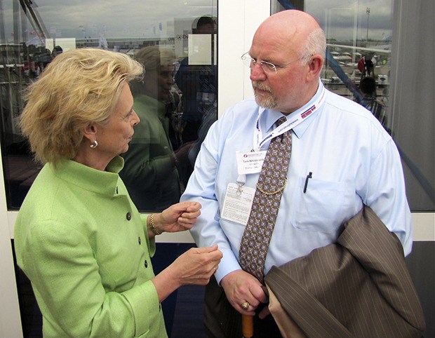 Machinists Union District 751 President Tom Wroblewski chats with then-Gov. Chris Gregoire at the 2011 Paris Air Show.