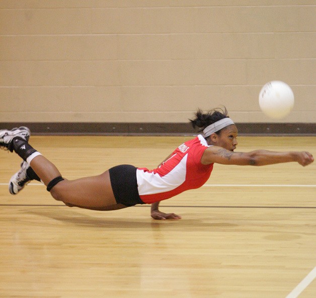 11/04/11 Kent-Meridian's Chloe Watson dives for a dig Friday