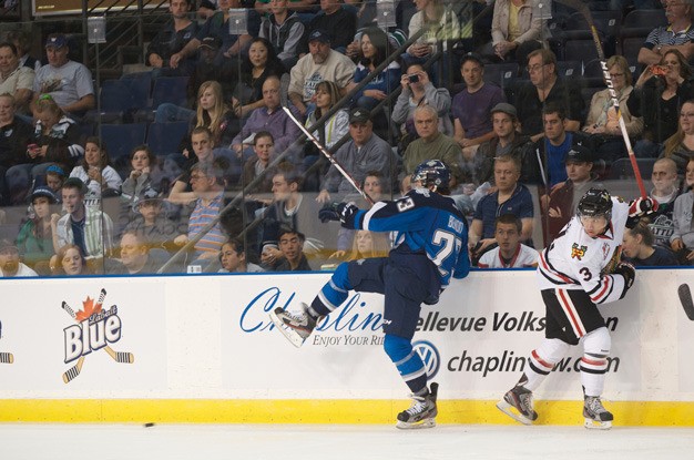 Fans watch the Seattle Thunderbirds at the ShoWare Center in Kent.