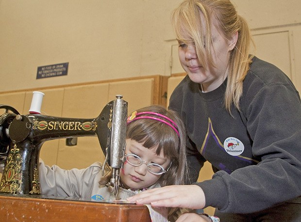 Mia McDunnah builds a bean bag with volunteer Erika Davies during last year's Kent Kids’ Arts Day.