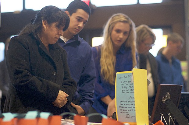 Mourners attend a memorial service for Teagan McGinnis