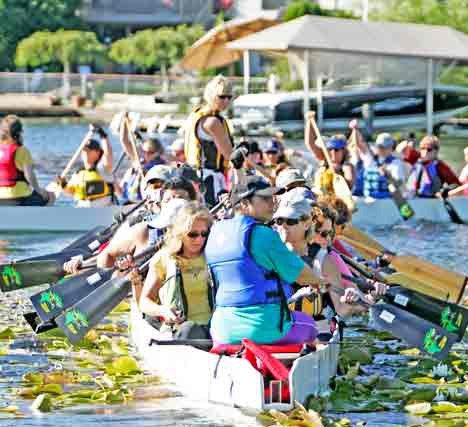 The Kent Dragon Boat Association coed team Dragin’ Tails begins practice Tuesday evening on Lake Meridian in Kent.