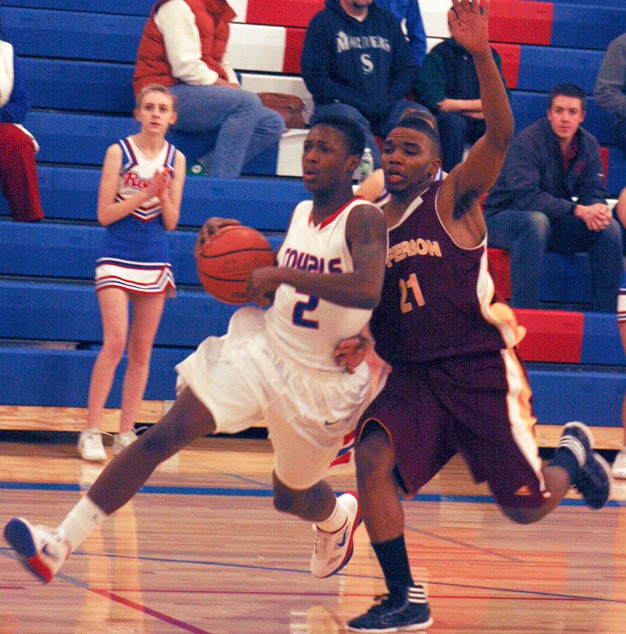 Mike Banks (2) and the rest of the Kent-Meridian boys basketball team will play Kentlake at 5 p.m. Friday