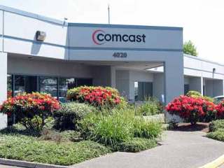 Kent city officials reached an agreement with Comcast to remove a monthly network add-on fee charged to cable subscribers. This Comcast office in Auburn also serves Kent residents.