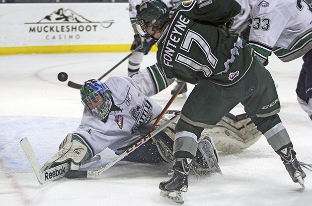 Thunderbirds goalie Danny Mumaugh denies the Silvertips' Matt Fonteyne