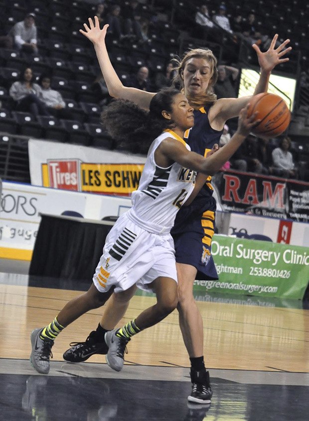 Kentridge's Tresai McCarver tries to drive past West Seattle's Lydia Giomi during ShoWare Shootout action Saturday.