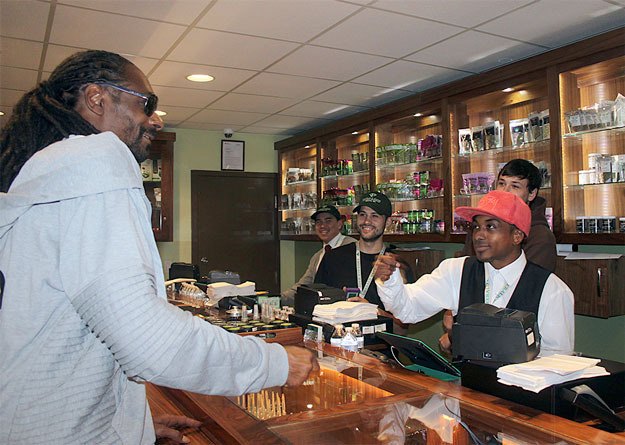 Rapper Snoop Dogg visits a Renton marijuana shop last year.