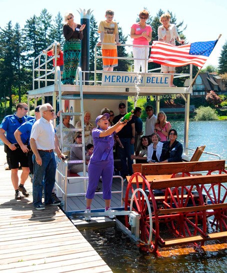 Kent Mayor Suzette Cooke helps launch the new Meridian Belle June 4 at Lake Meridian in Kent.