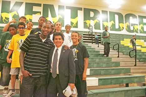 Atlanta Hawks player Jamal Crawford poses with Kent School District Superintendent Edward Lee Vargas and participants in the Youth 180 program after his presentation at Kentridge Aug. 8.