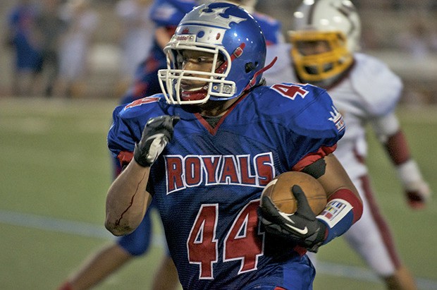 The Royals' Vinnie Malietufa darts into the open field against the Raiders during SPSL North 4A play Thursday night.