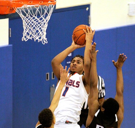 Kent-Meridian's Martel Taylor-Barone drives to the basket against Kentlake Dec. 16. Kent-Meridian plays twice in January in tournaments at the ShoWare Center.