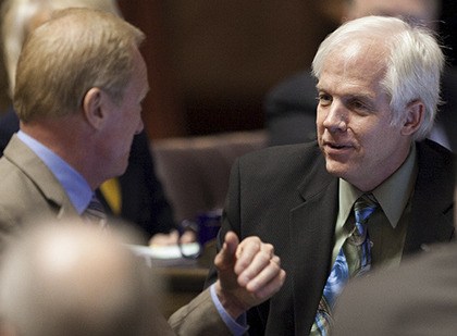 Rep. Mark Hargrove working with fellow members during a floor debate.