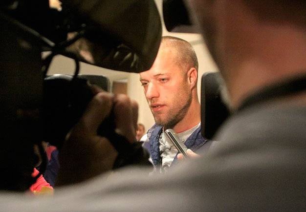 Patrick Auble talks with reporters last September after pleading not guilty to rendering criminal assistance in connection with the Kent car show shooting last July. A judge sentenced Auble July 6 to one year in jail.