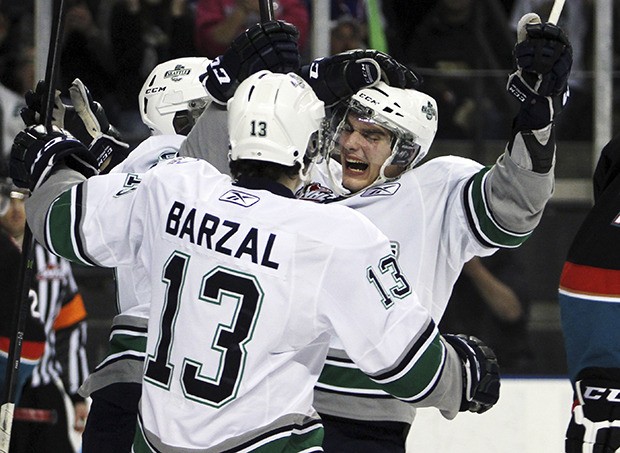 The T-Birds' Mathew Barzal and Justin Hickman celebrate a goal. Seattle