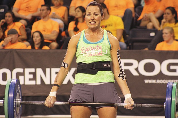 Kerry Hanson pulls 185 pounds from the floor before racing to do 24-inch box jumps in a partner heat at the CrossFit Northwest Games at the ShoWare Center last weekend.