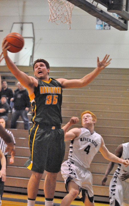 Kentridge's Joe Wainhouse grabs a rebound against Auburn Riverside. Kentridge plays Kentlake at 5:30 p.m. on Friday