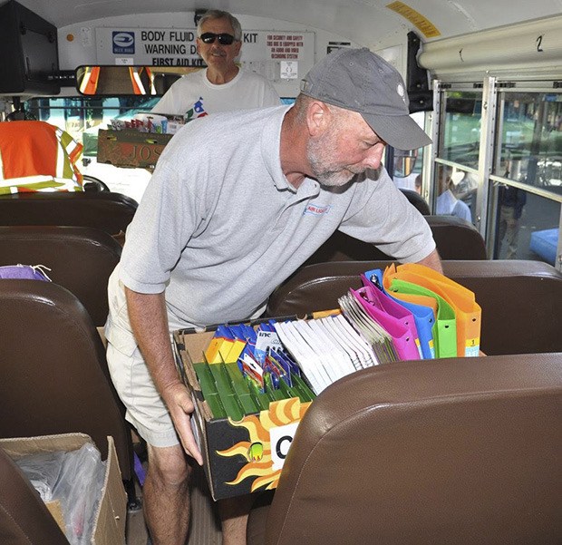 Tom Wood and Lyn Johnson help Fill the Bus