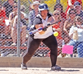 Kentwood's Kayla Evans lays down a bunt during the team's state opener against Mountlake Terrace on Friday. Evans no-hit the Hawks