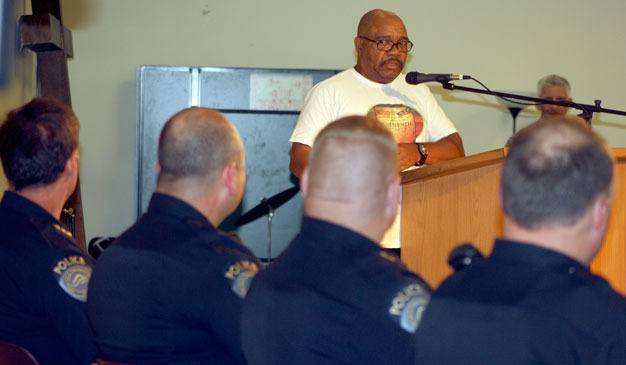 Richard Johnson speaks at a Kent Police community meeting on Thursday night at Kent Covenant Church as Police Chief Ken Thomas