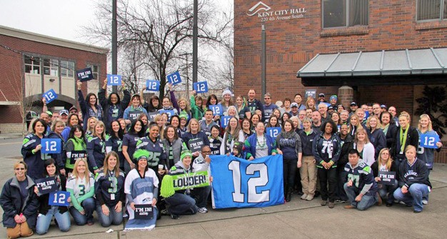 Kent city employees gather for a Blue Friday photo to support the Seattle Seahawks.