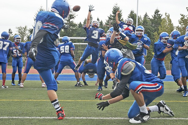 Kent Meridian defensive players practice blocking kicks in preparation for their Sept. 6 opener at Tahoma.