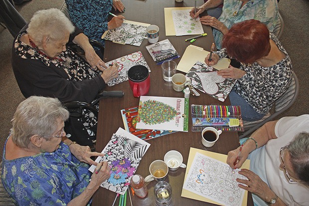 Scenic Vista residents gather to color books as a way to relax.