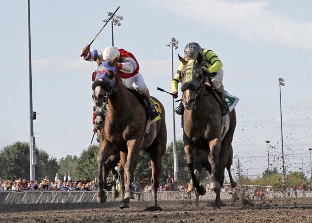 Class Included (right) holds off long shot Playful Argument and prevails in the 32nd running of the $65