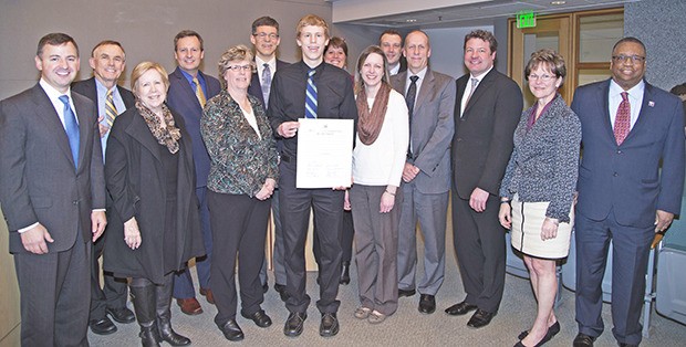 Members of the King County Council join Nick Porter and his parents