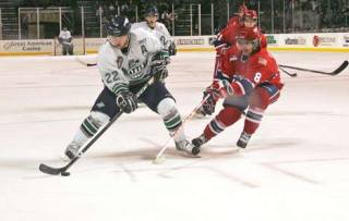 Seattle’s Greg Scott tries to get past Spokane defender Brenden Kichton during Tuesday night’s game at the ShoWare Center in Kent.