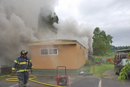 Kent firefighters quickly put out a mobile home fire early Friday morning. Eight people safely escaped.