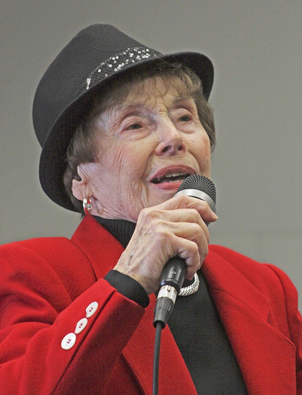 Charline Payne performs a number during karaoke at the Kent Senior Center.