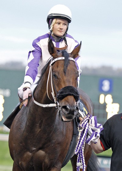 Apprentice Eliska Kubinova and Chaching Pete head to the winner's circle after a victory in the Johnsonville Purse for 3-year-olds and up Saturday at Emerald Downs. Kubinova was the day's riding star with three wins including a victory in her first Quarter Horse race. Sept. 24