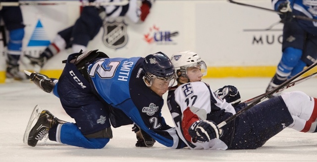 Seattle defenseman Jerret Smith collides with Tri-City's Philip Tot during the Thunderbirds' 4-2 victory Saturday night.