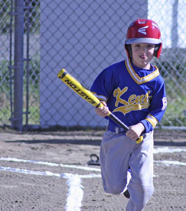 The Mariners’ Chase Morraitis carries his bat down to first base after connecting  for a hit in a machine pitched division game last Saturday at Ryan Brunner Park.