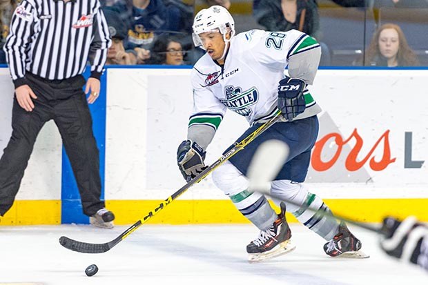 The Thunderbirds' Keegan Kolesar pushes the pubck up the ice during WHL play Sunday. Koelsar's hat trick powered the T-Birds to a 4-2 win over Victoria.