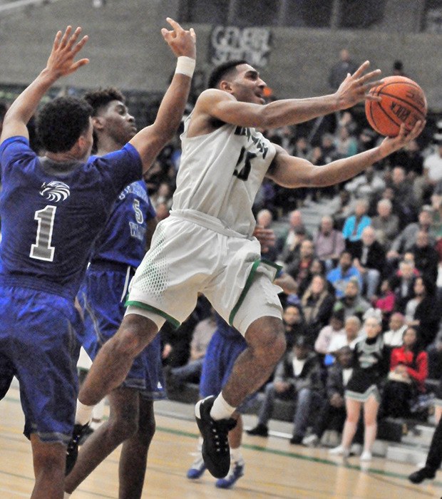 Kentwood's Darius LuBom drives for two against Federal Way in district action.