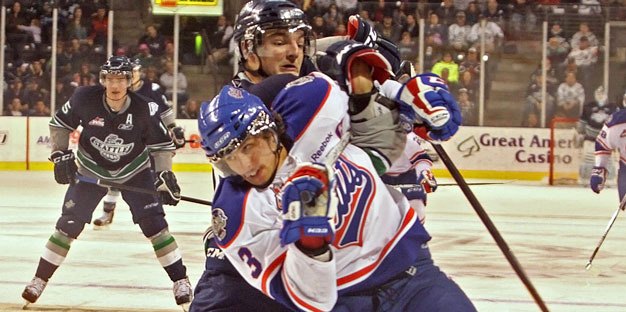 Seattle Thunderbird Branden Troock tussles with Regina's Brandon Davidson in a game last season at the ShoWare Center.