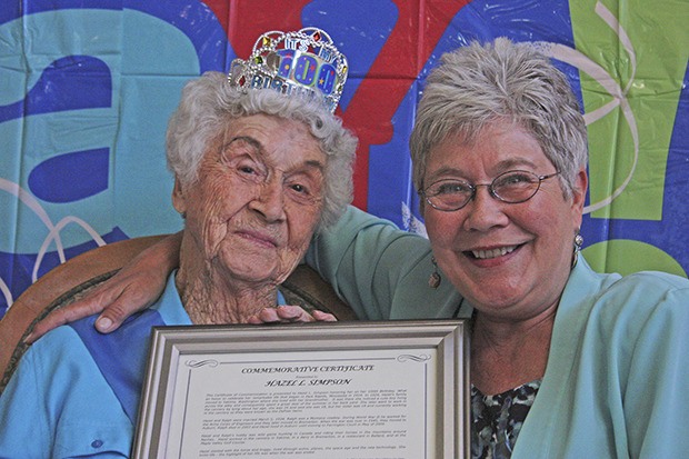 Hazel Simpson joins Mayor Suzette Cooke at her birthday party last Friday. Cooke presented Hazel with a commemorative certificate