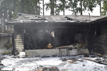 Firefighters from the Kent Fire Department RFA and Maple Valley doused a fire that destroyed a Covington house on Sunday.