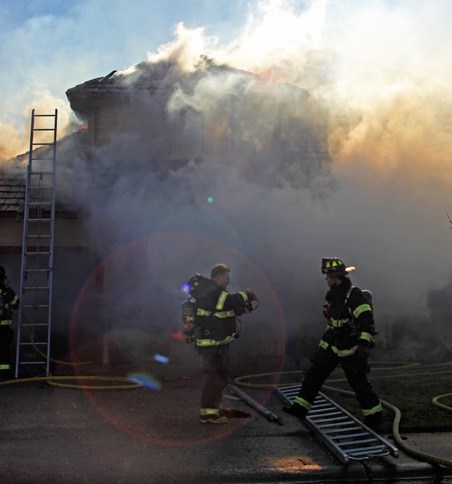 Firefighters battle a house fire on Kent's West Hill on Wednesday