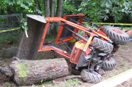 Kent firefighters rescued a man trapped under this tractor Thursday in the 14500 block of Southeast 288th Place.